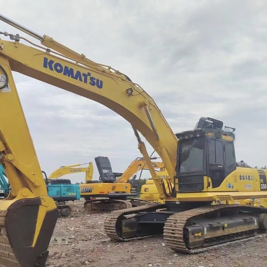 Second-hand large excavators, including Komatsu PC350, PC400, and PC450.
